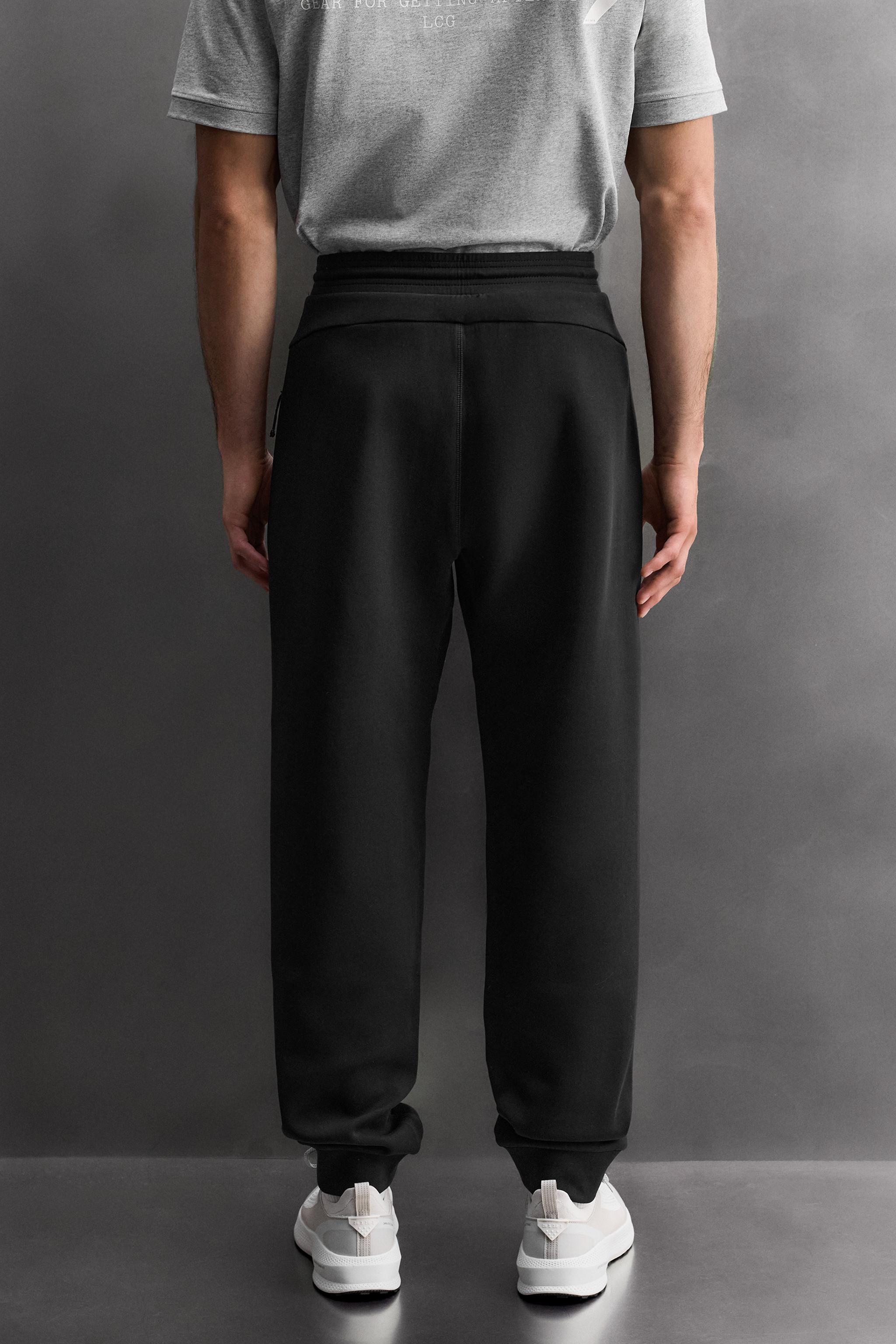TECHNICAL PANTS WITH ZIPPERS